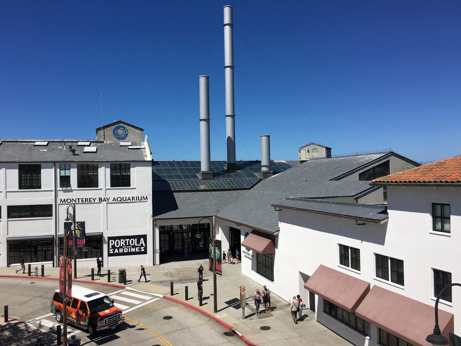 The Monterey Bay Aquarium's main entrance, crowned by smokestacks honoring the Hovden Cannery it replaced. 'Ocean in Motion / La Danza del Mar' opens Nov. 7.