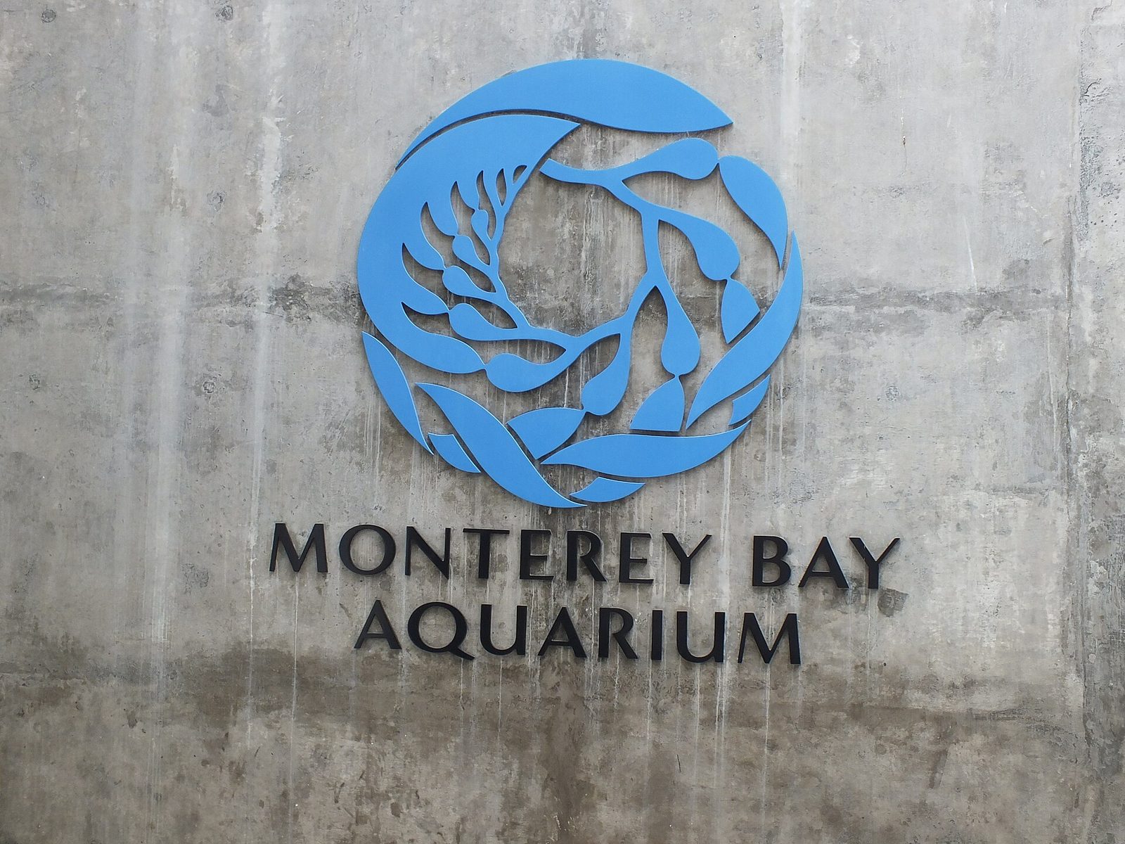 The Monterey Bay Aquarium sign on Cannery Row. A federal appeals court has ordered dismissal of the defamation suit Maine lobster businesses brought against the aquarium foundation over its Seafood Watch rating.
