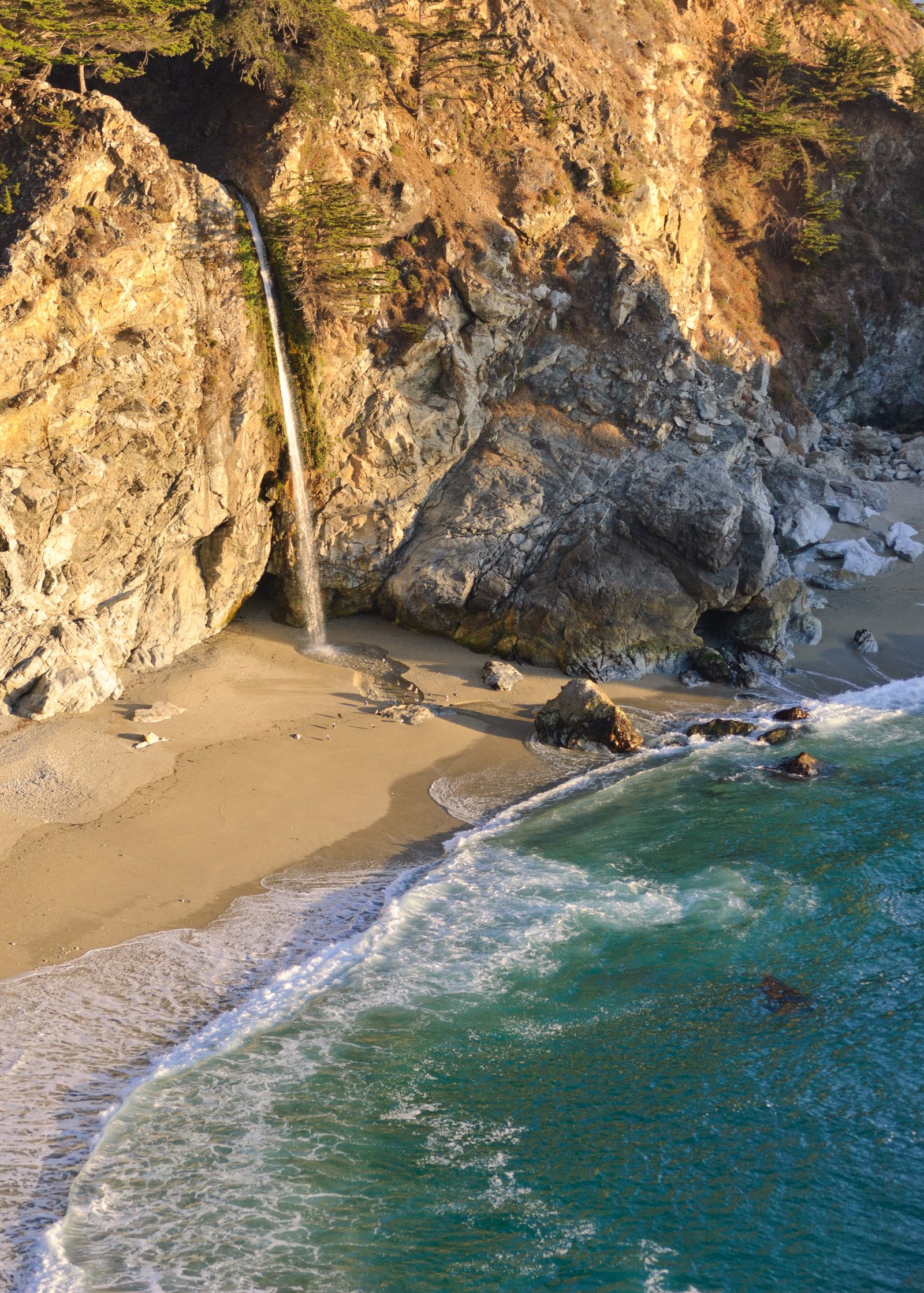 McWay Falls drops 80 feet onto the sand at Julia Pfeiffer Burns State Park in Big Sur, south of the Peninsula's cities along Highway 1.