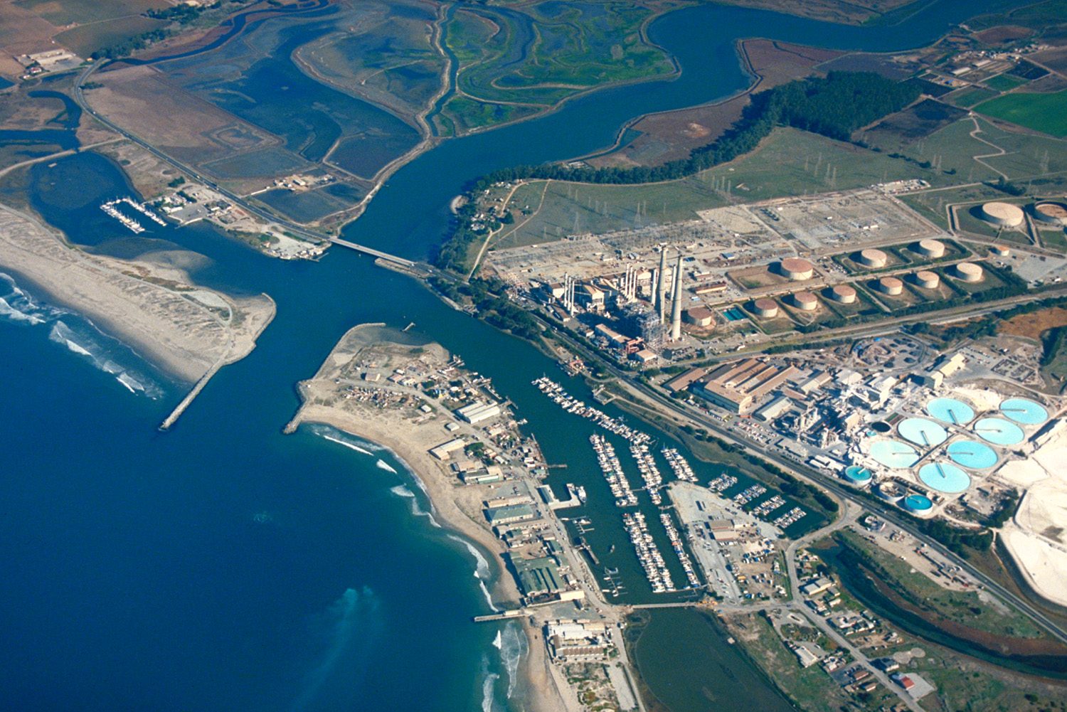 An aerial view of Moss Landing, with Elkhorn Slough running inland and the Moss Landing Power Plant at center. After investigators believed the girl's father had taken her to Mexico, the Sheriff's Office, the FBI and Mexican authorities worked together on the case.