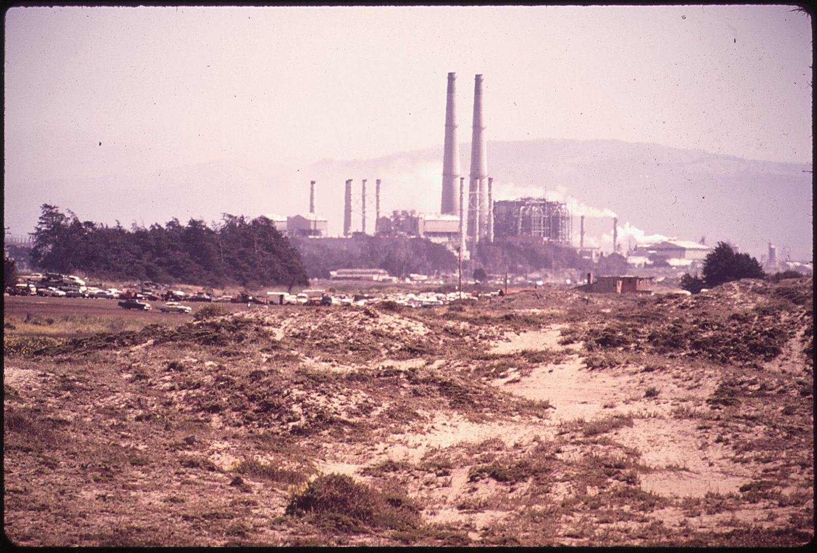 The Moss Landing Power Plant stacks, seen from the dunes in this May 1972 photograph. The unincorporated community sits at the midpoint of Monterey Bay, where the investigation into the newborn's death began.