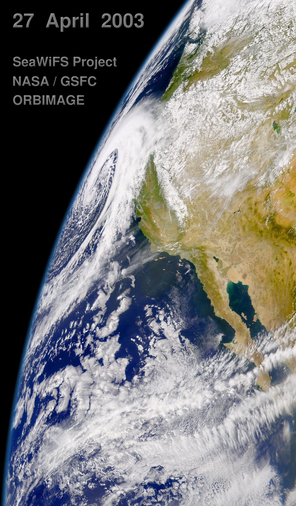 A NASA satellite view of a low-pressure storm system spinning toward the northern California coast, with Monterey Bay visible beneath the clouds. NOAA puts the odds of a "very strong" El Niño this fall and winter at 90 percent, and Salinas has declared a local state of emergency to prepare.
