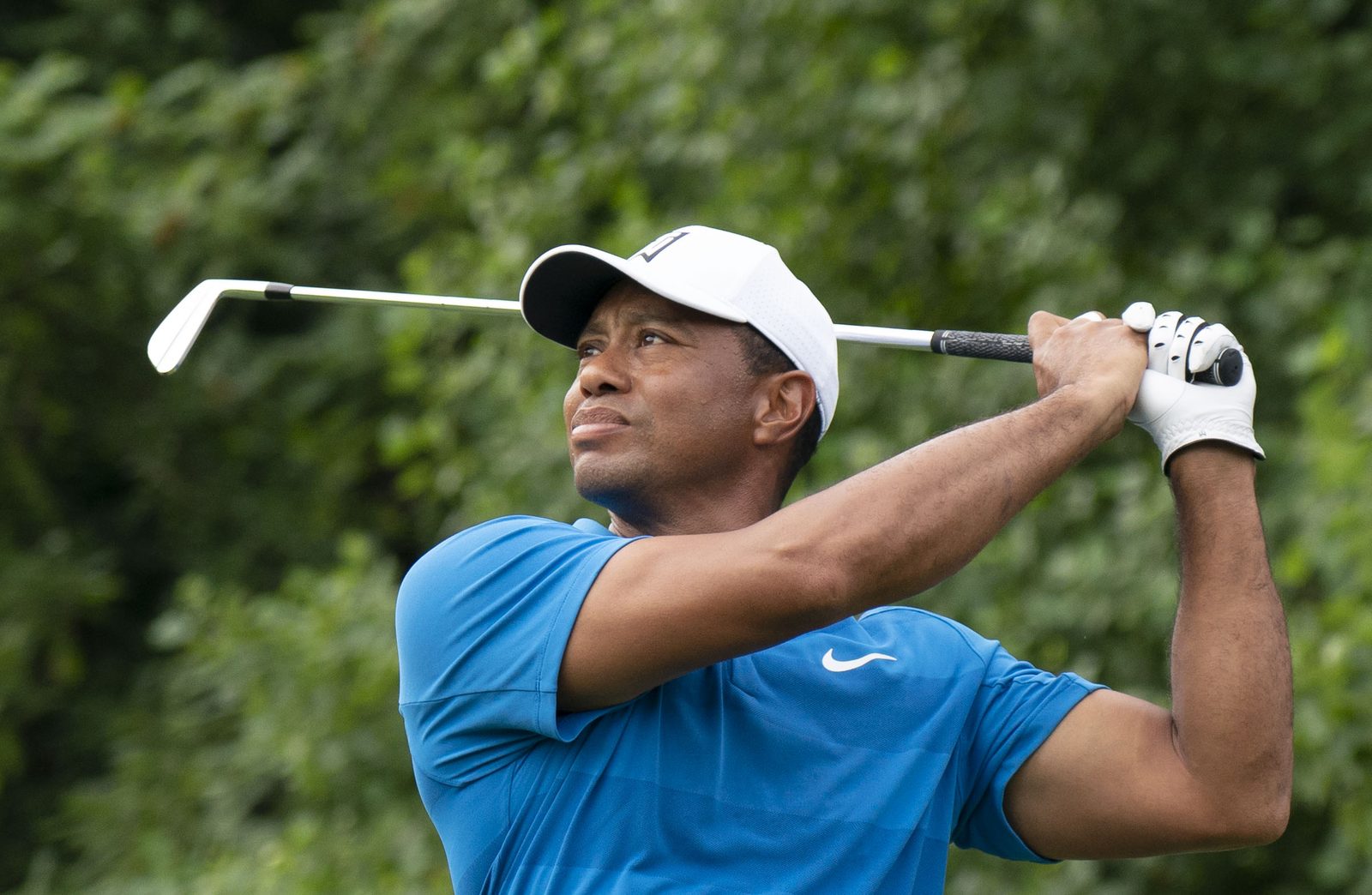 Tiger Woods watches a shot during the 2018 Quicken Loans National. On Tuesday, the 15-time major champion was back on a driving range on the Monterey Peninsula, hosting a clinic at Monterey Peninsula Country Club during his foundation's invitational.