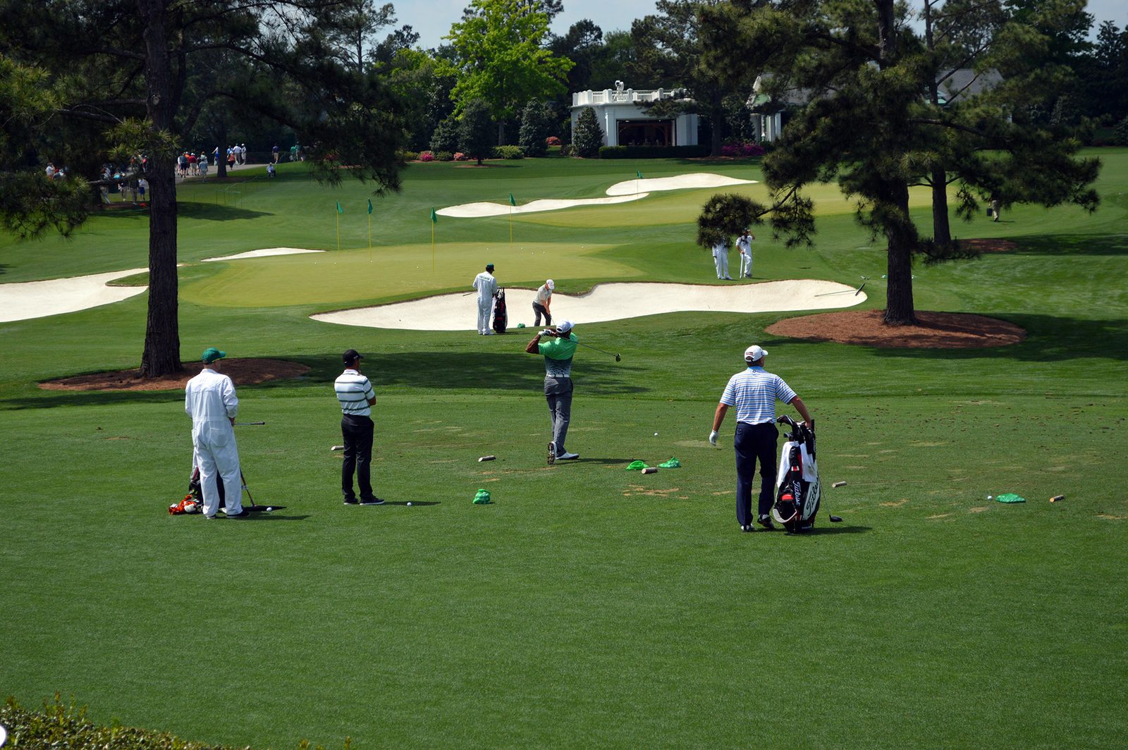 Woods works on the practice ground during the 2015 Masters at Augusta National. Reports from Monterey Peninsula Country Club on Tuesday described him hitting full iron shots and wedge shots during the clinic and talking guests through his approach.